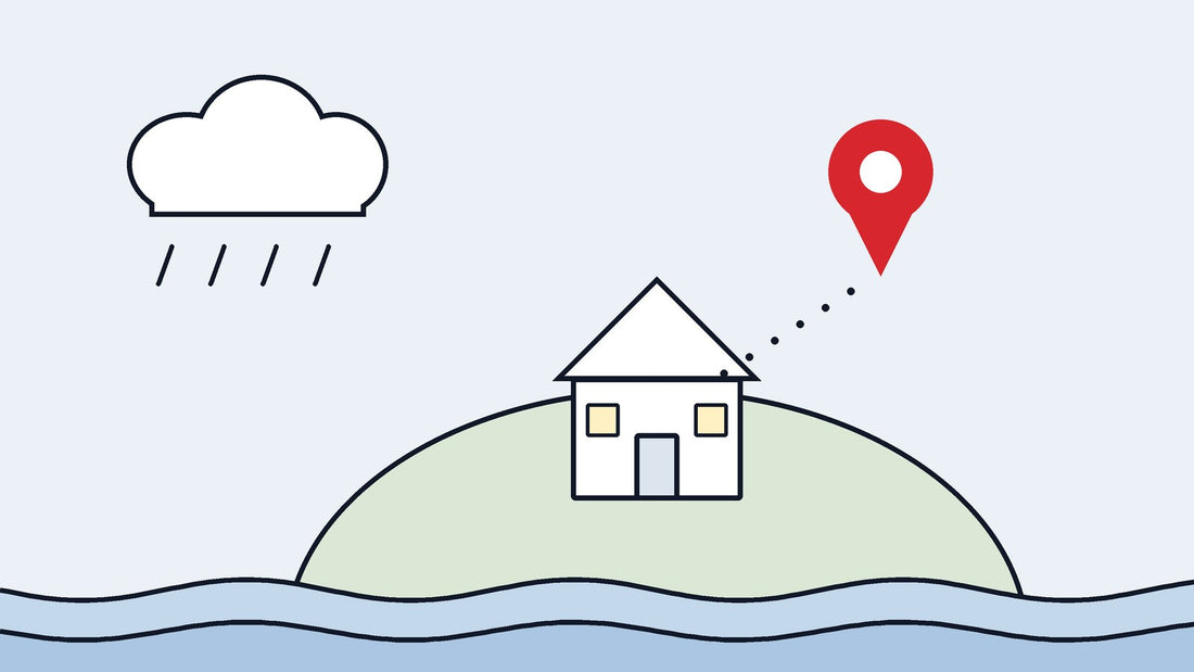 House on a hill above flood water, with a map pin marking its location