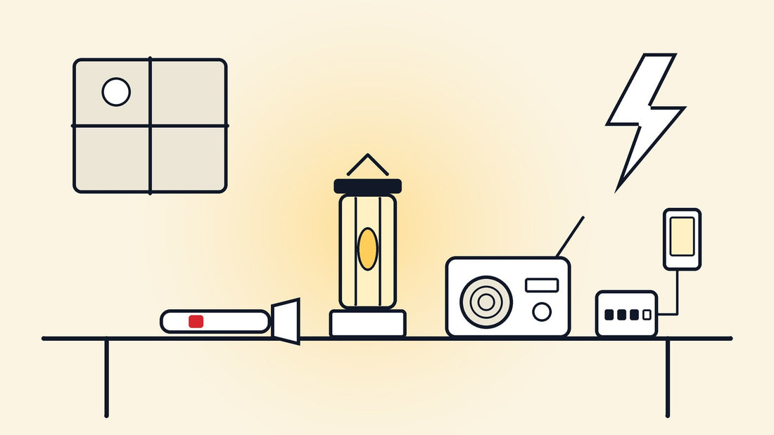 Torch, lantern, battery radio and power bank on a table during a power cut