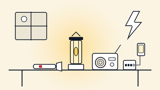 Torch, lantern, battery radio and power bank on a table during a power cut
